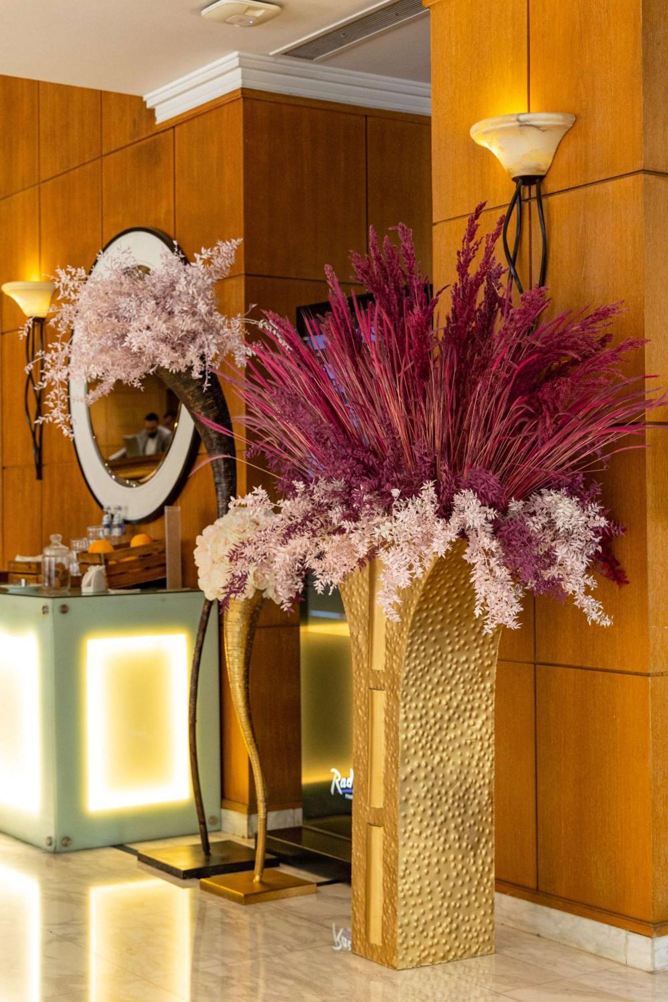 Radisson Blu Martinez Beirut Hotel Exterior photo Dried flowers in a vase