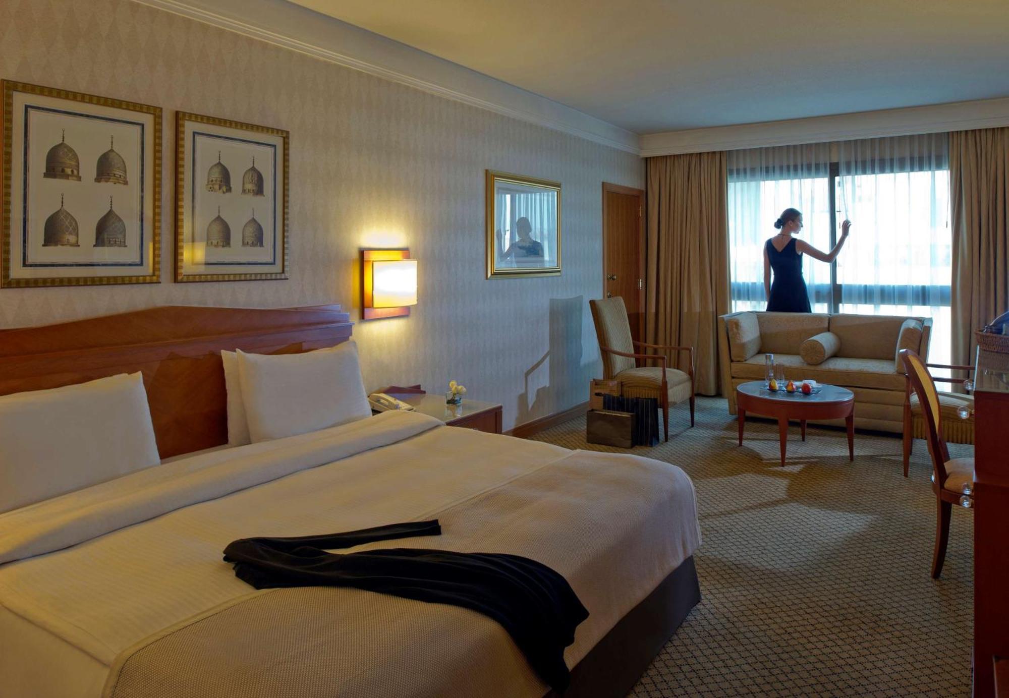 Radisson Blu Martinez Beirut Hotel Exterior photo A maid cleaning a hotel room