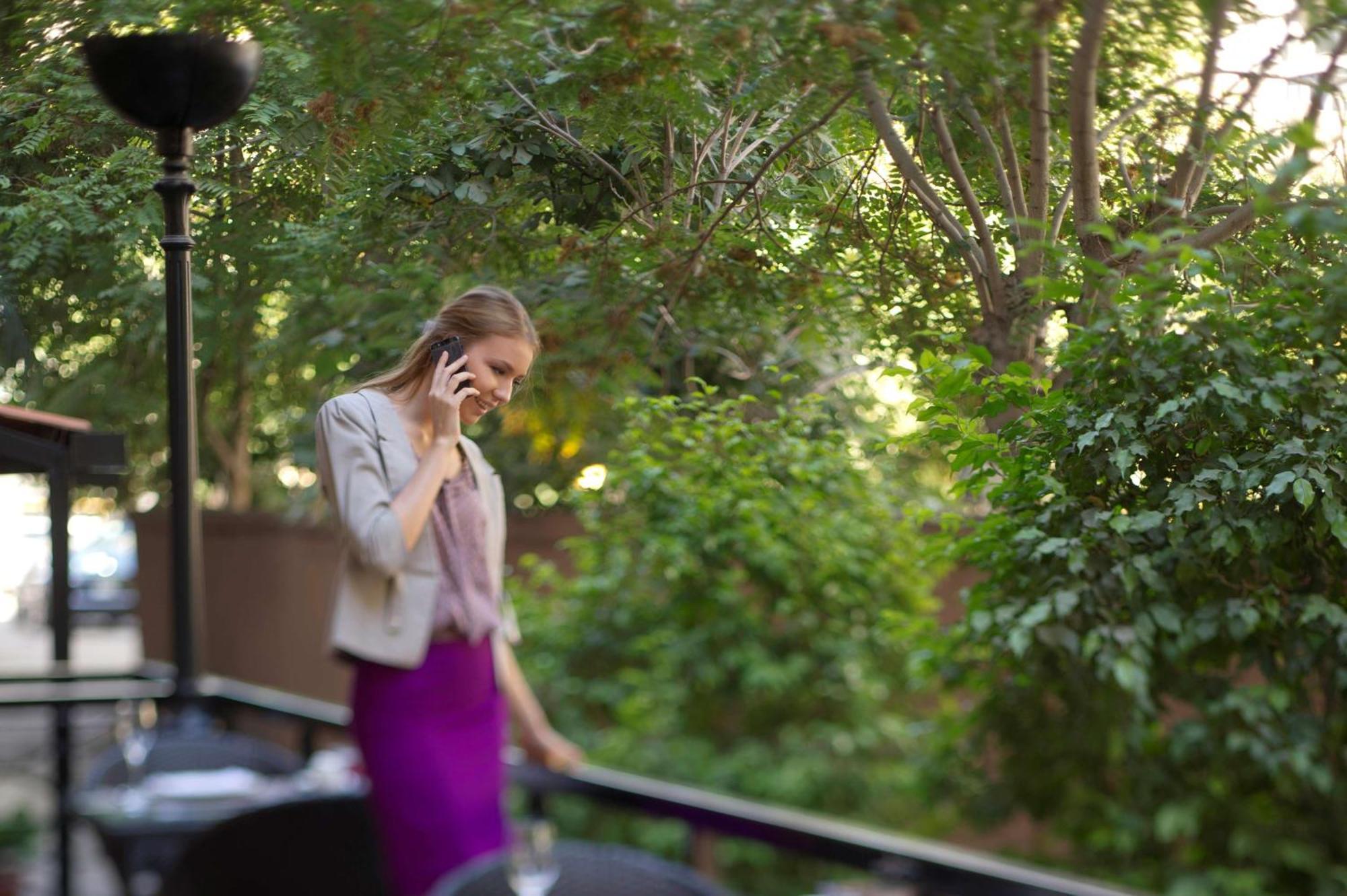 Radisson Blu Martinez Beirut Hotel Exterior photo A woman on a mobile phone